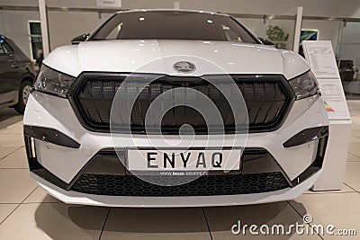new white electric Skoda Enyaq electric car, Czech EV manufacturer, Volkswagen AG in showroom, Green Mobility, technology in Editorial Stock Photo